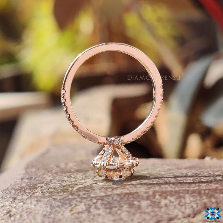 Rose gold engagement ring with pave setting.
