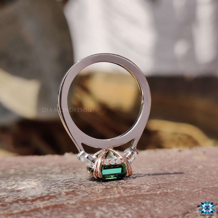 White gold engagement ring featuring triple halo setting.