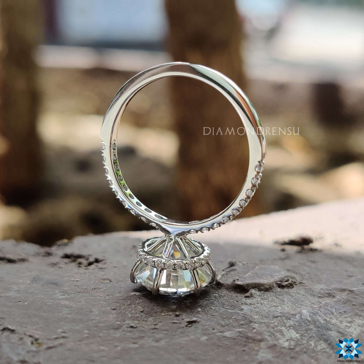 Custom round moissanite ring with pave setting.