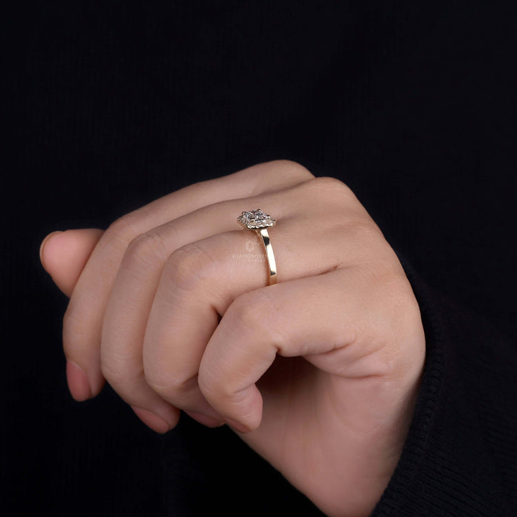 Halo ring setting highlighting the beauty of emerald cut diamonds.
