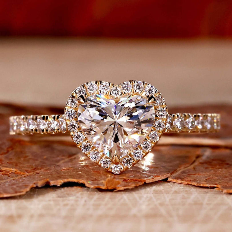 Heart shaped diamond ring with a stunning halo ring setting and pave diamonds for timeless elegance.