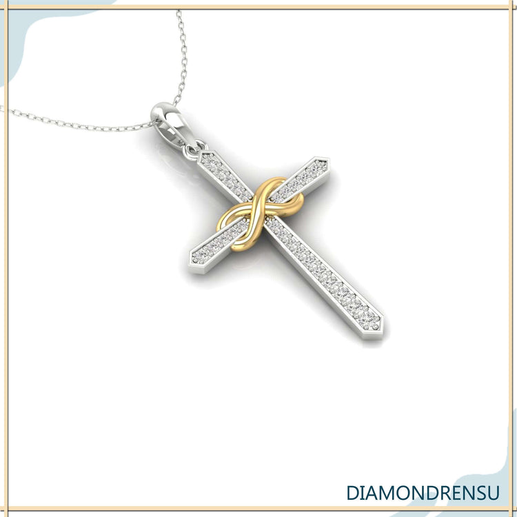 Cross pendant featuring lab grown diamond in white gold.