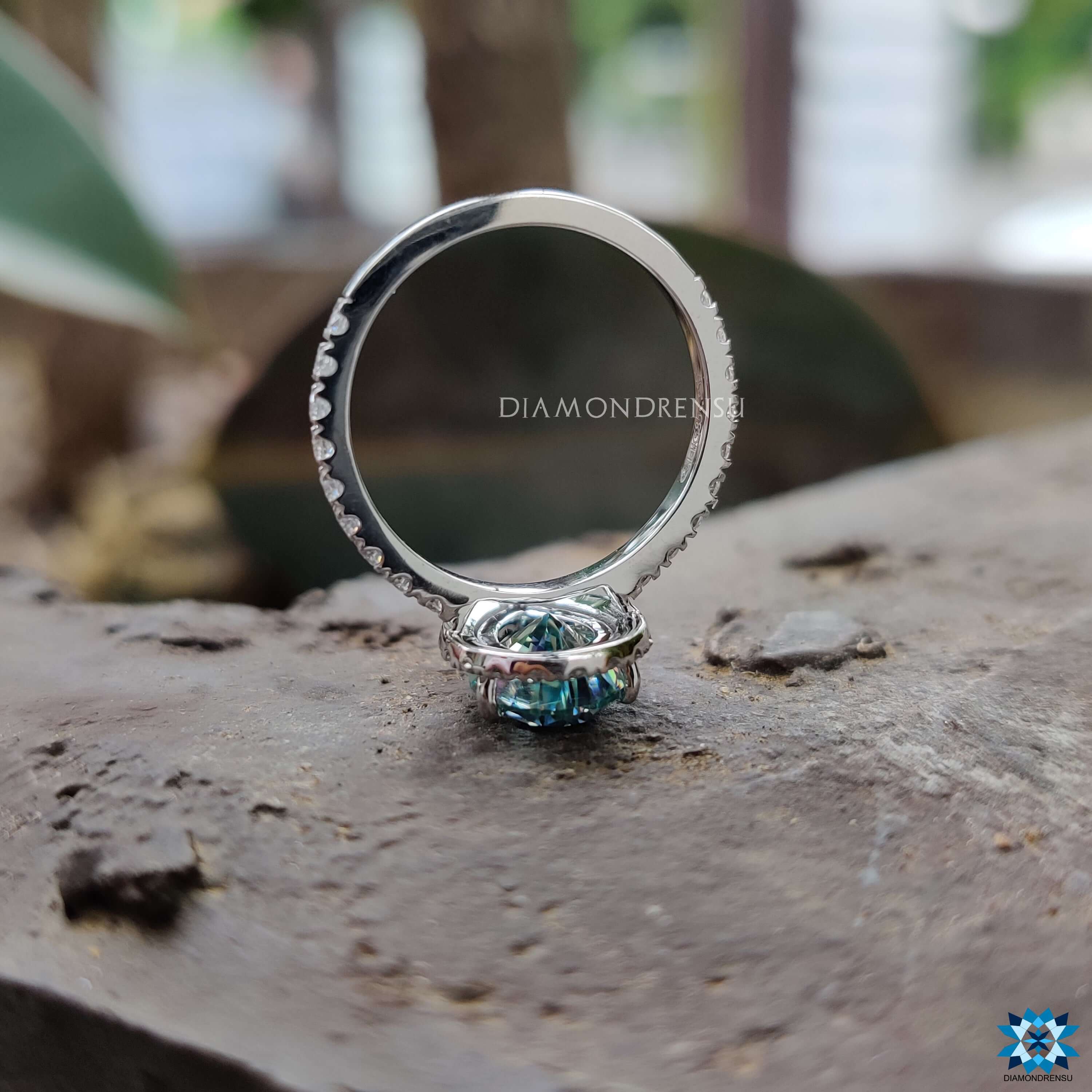 Cyan blue moissanite solitaire ring in a classic pear shaped design.