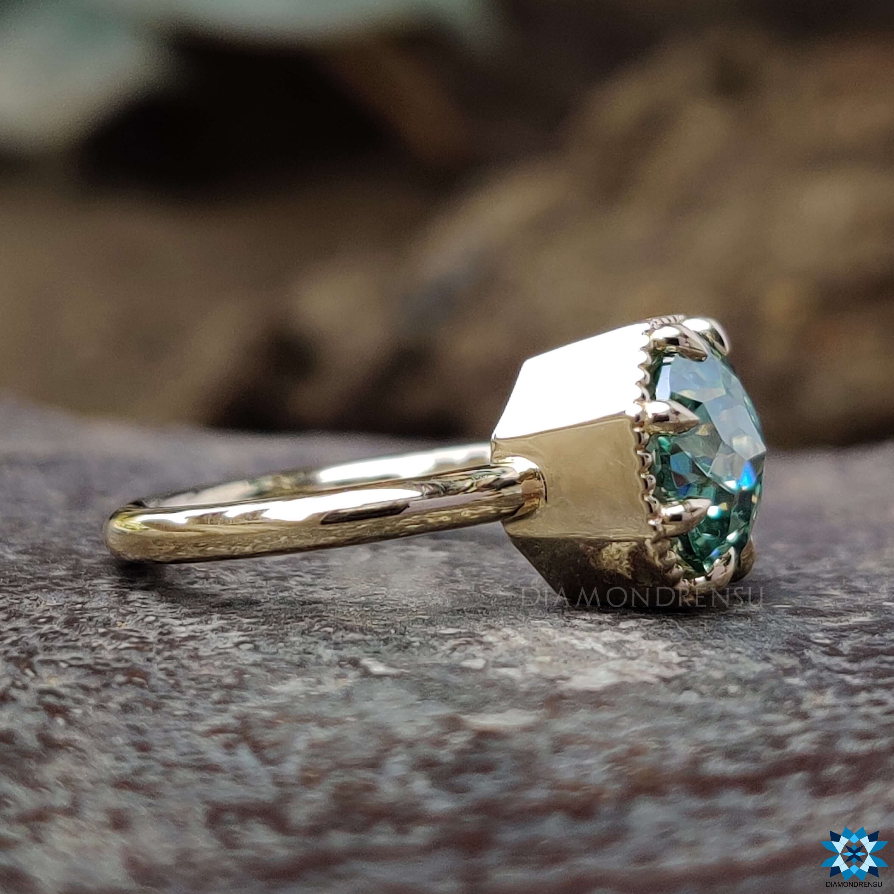 8 claw prong yellow gold solitaire ring.