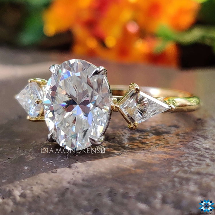 Kite cut moissanite ring in yellow gold.