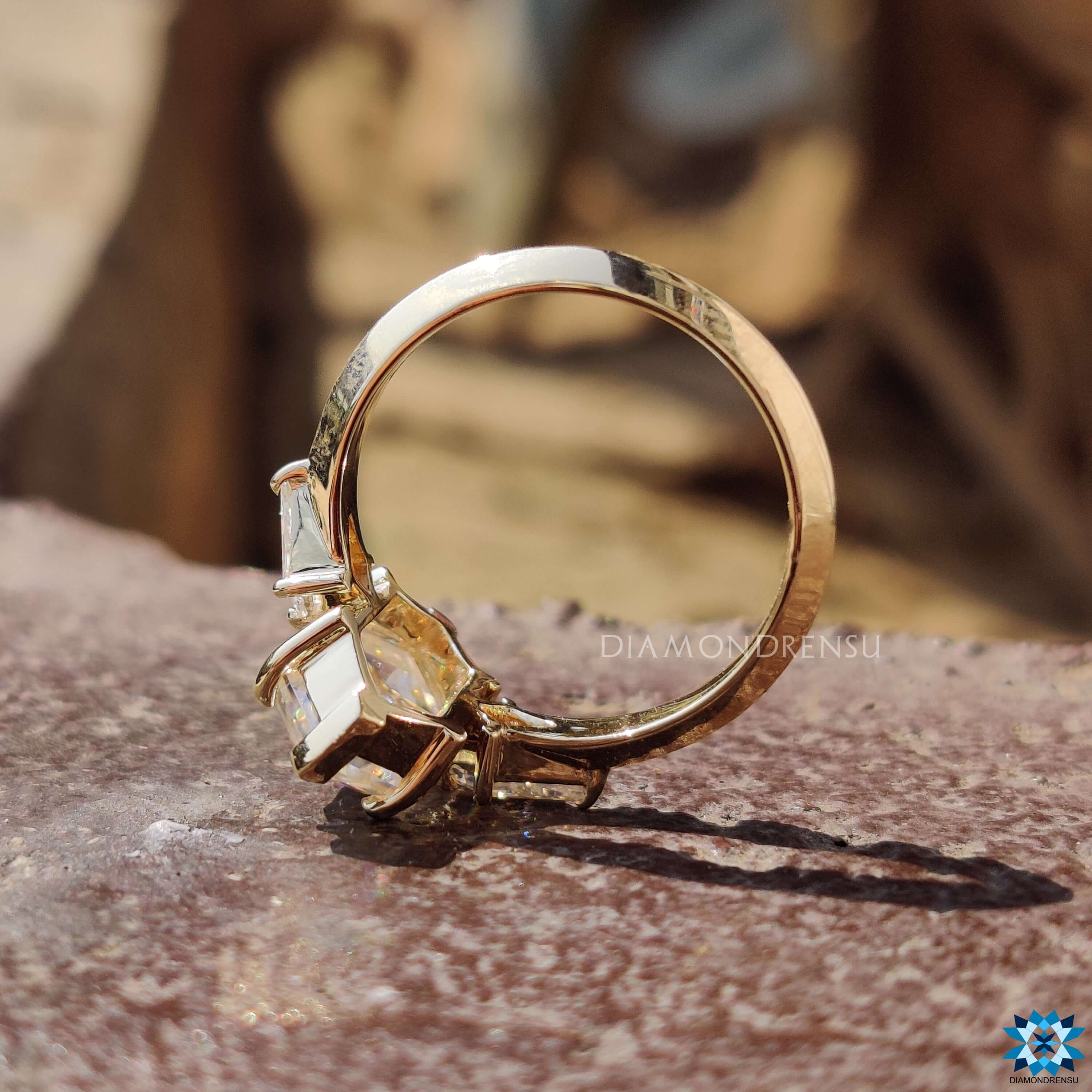 Hexagon rose cut moissanite in yellow gold setting.