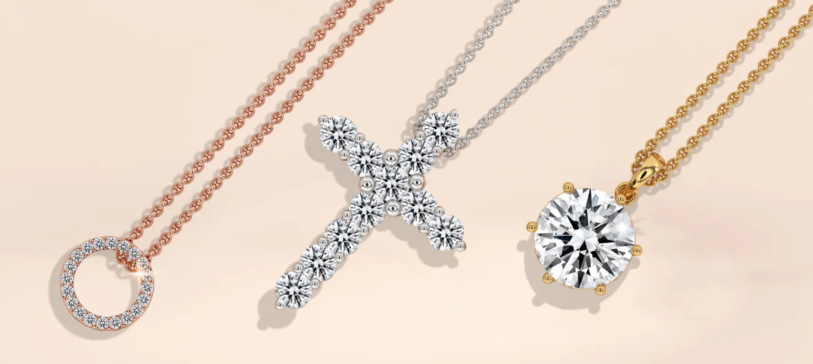 White Gold Cross and yellow gold Solitaire pendants. White Gold Cross and yellow gold Solitaire pendants.