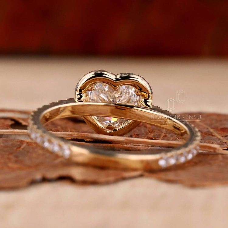 Halo ring featuring pave diamonds and a heart shaped style in a handmade jewelry design.