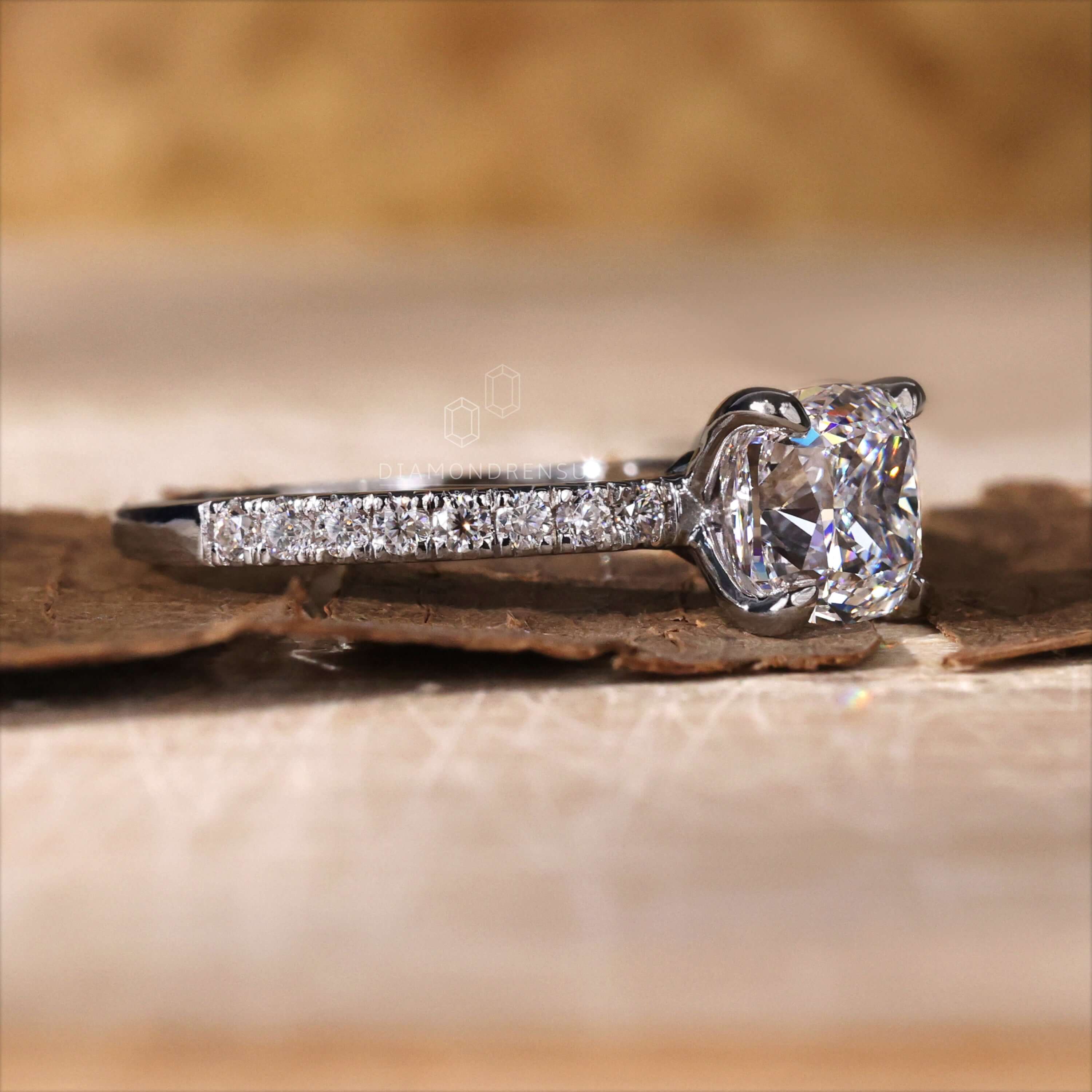 Cushion cut ring crafted with exquisite pave diamonds and an igi certified Lab Grown Diamond for sustainable luxury.