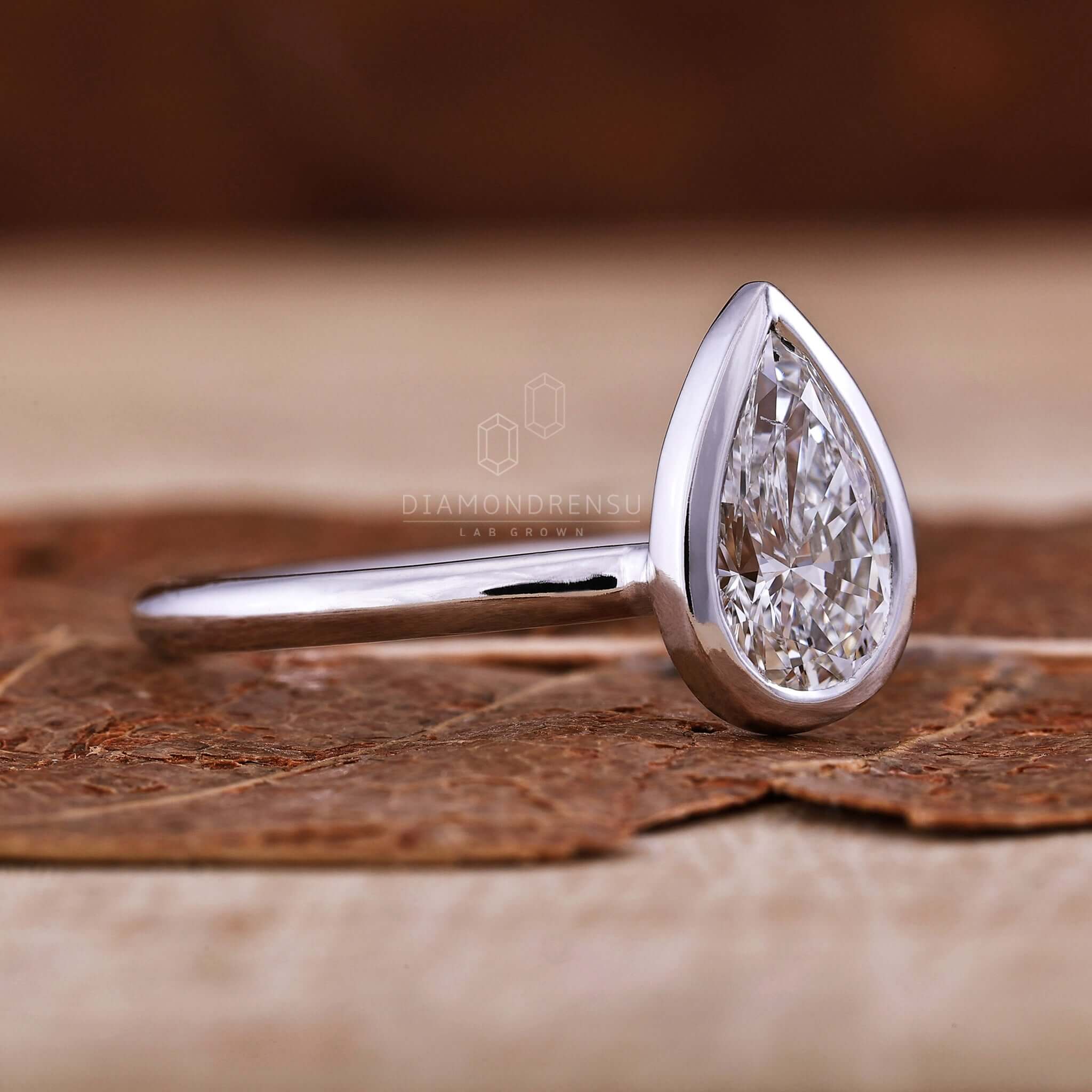 Pear shaped ring diamond crafted with knife edge detail for added brilliance