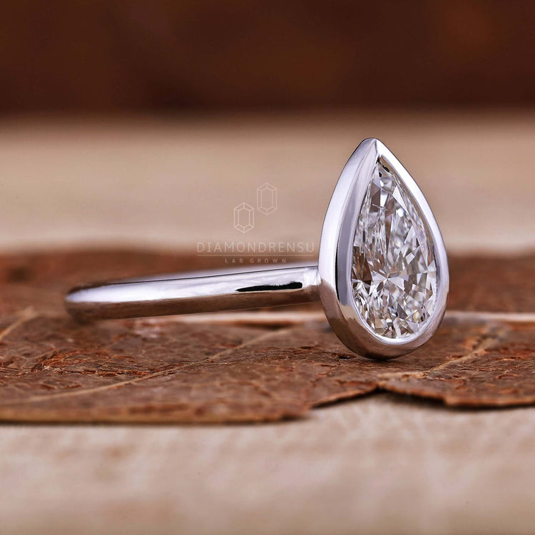 Pear shaped ring diamond crafted with knife edge detail for added brilliance