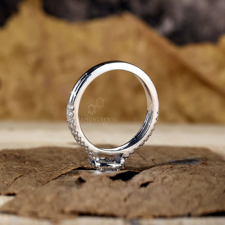 IGI certified handmade ring with a round diamond and halo design.