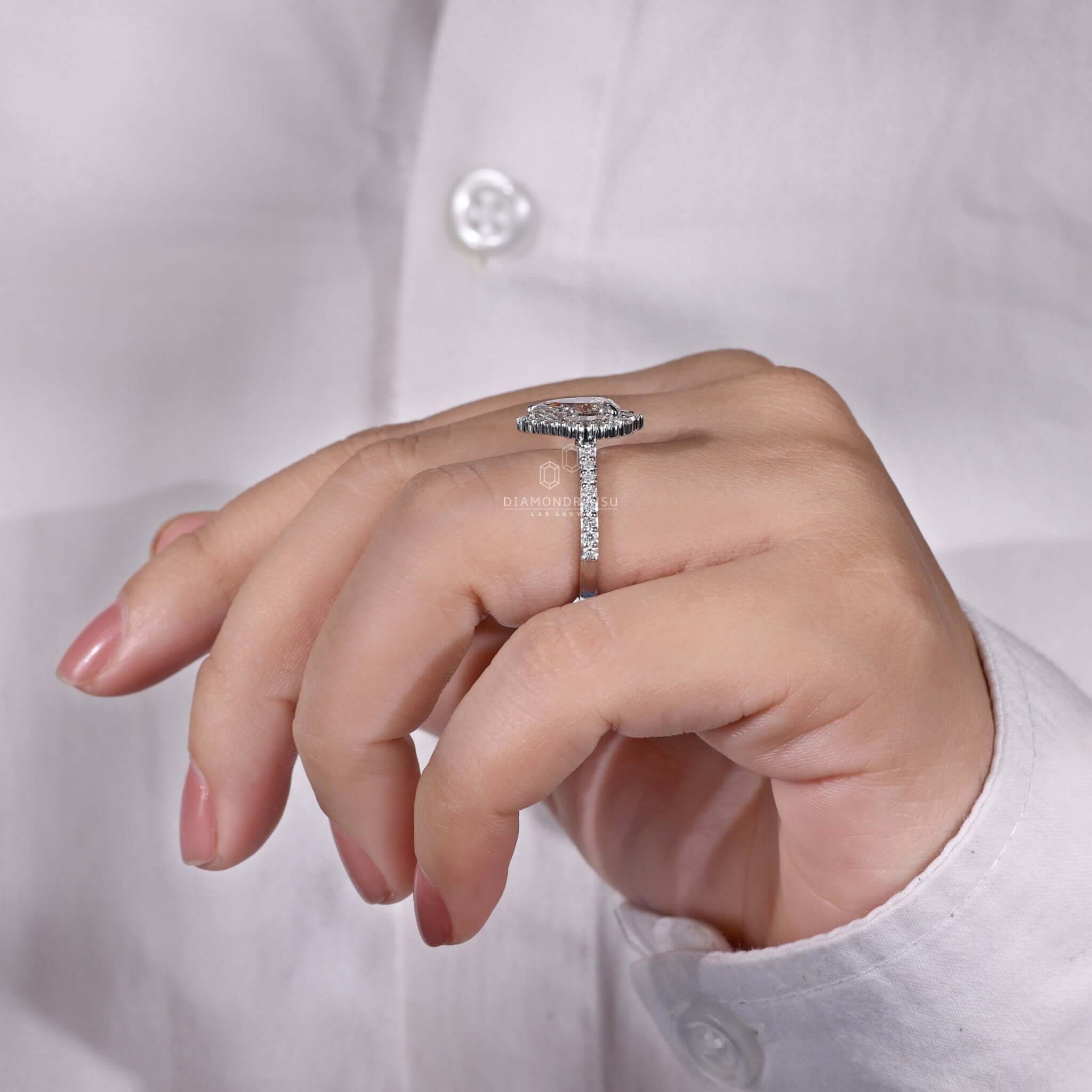 Pave pear shaped engagement ring with dazzling craftsmanship.