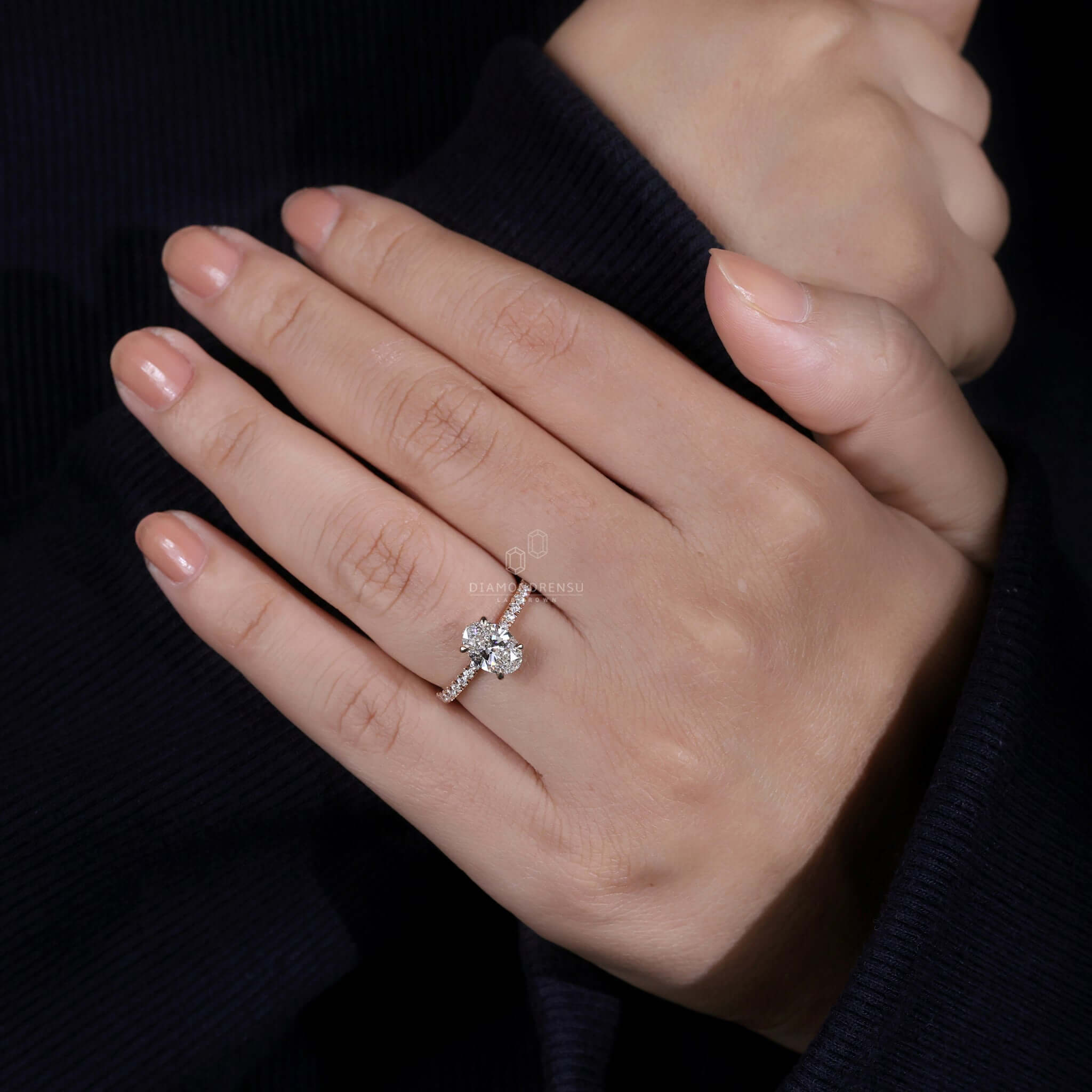 Handmade jewelry showcasing a diamondrensu UK ring with a Lab Grown Diamond in an oval hidden halo engagement ring.