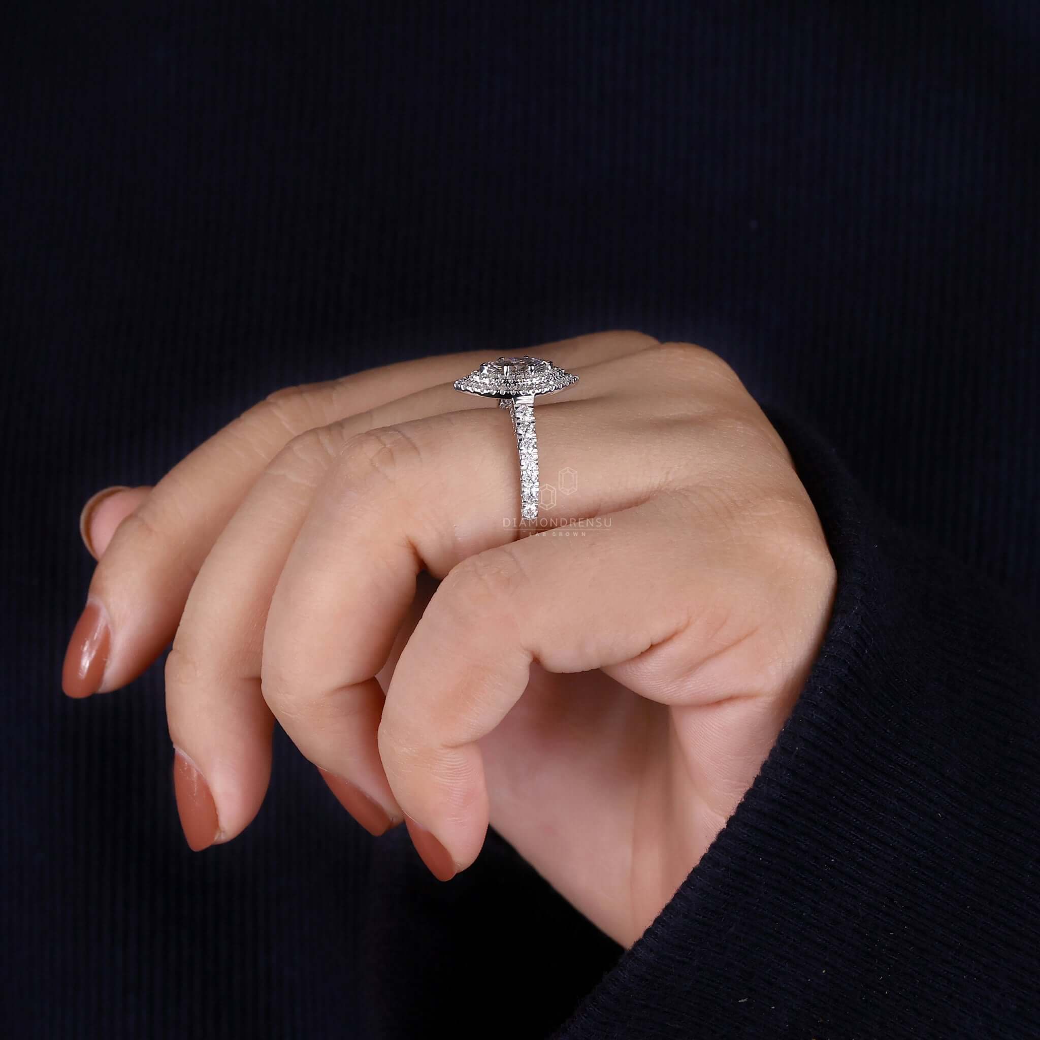Unique engagement ring featuring marquise cut diamond in a handmade jewelry design.