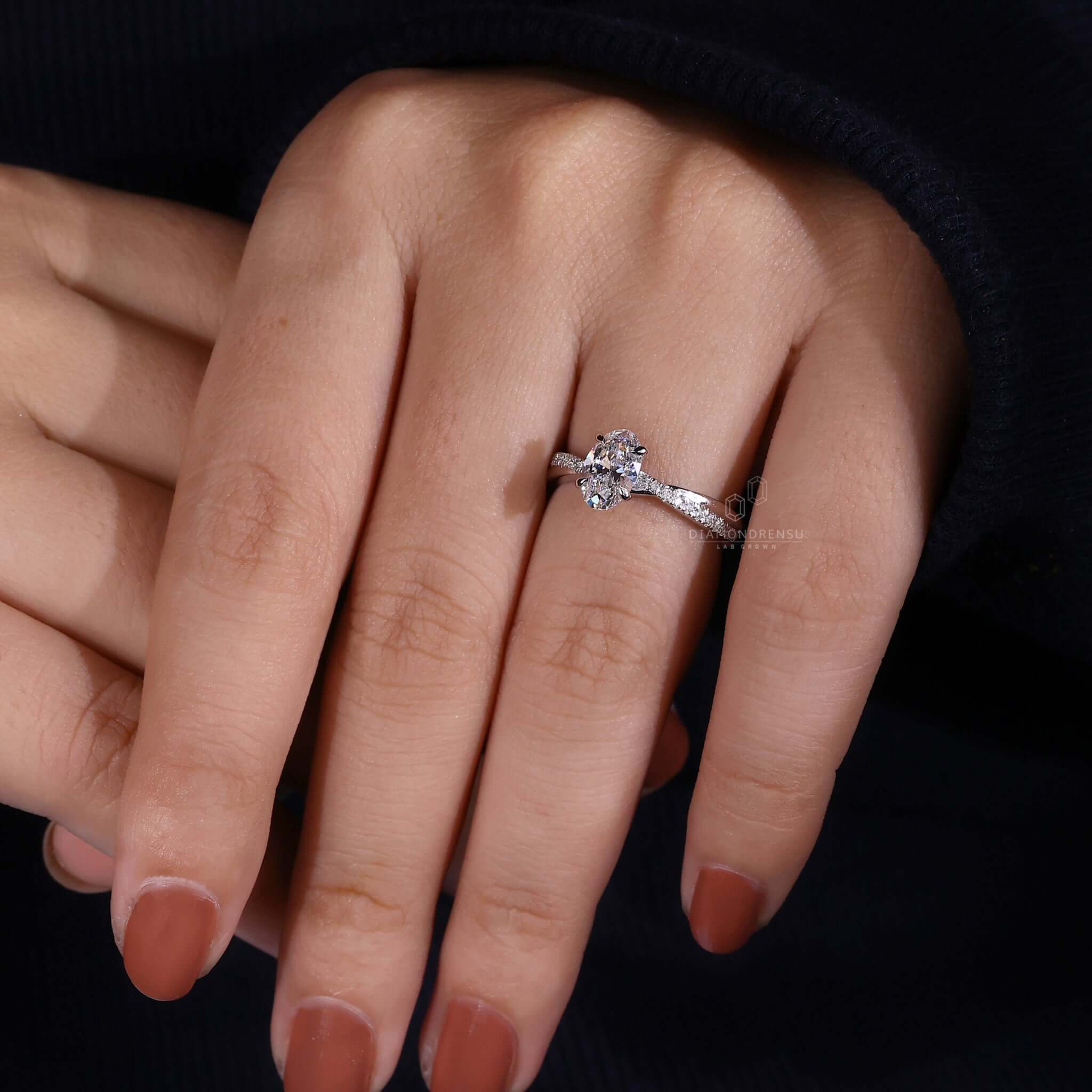 Oval diamond engagement ring with a pave setting, ideal as a handmade jewelry piece for a UK engagement ring.