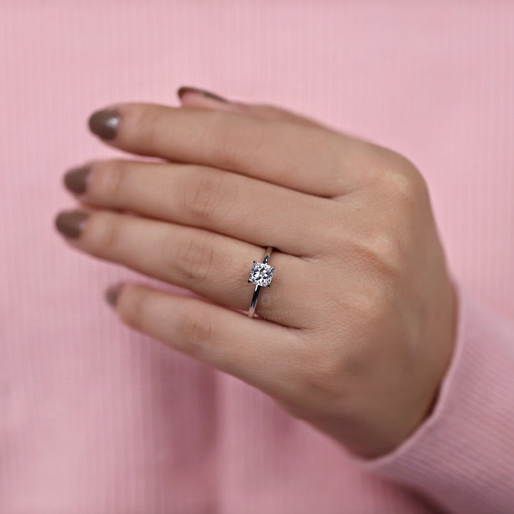 Classic diamond solitaire ring with prong setting detail.