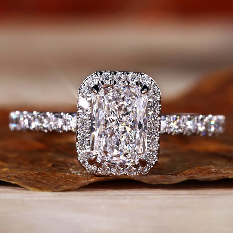 Radiant Cut Diamond Ring with a halo ring setting and pave diamonds for a timeless engagement ring design.