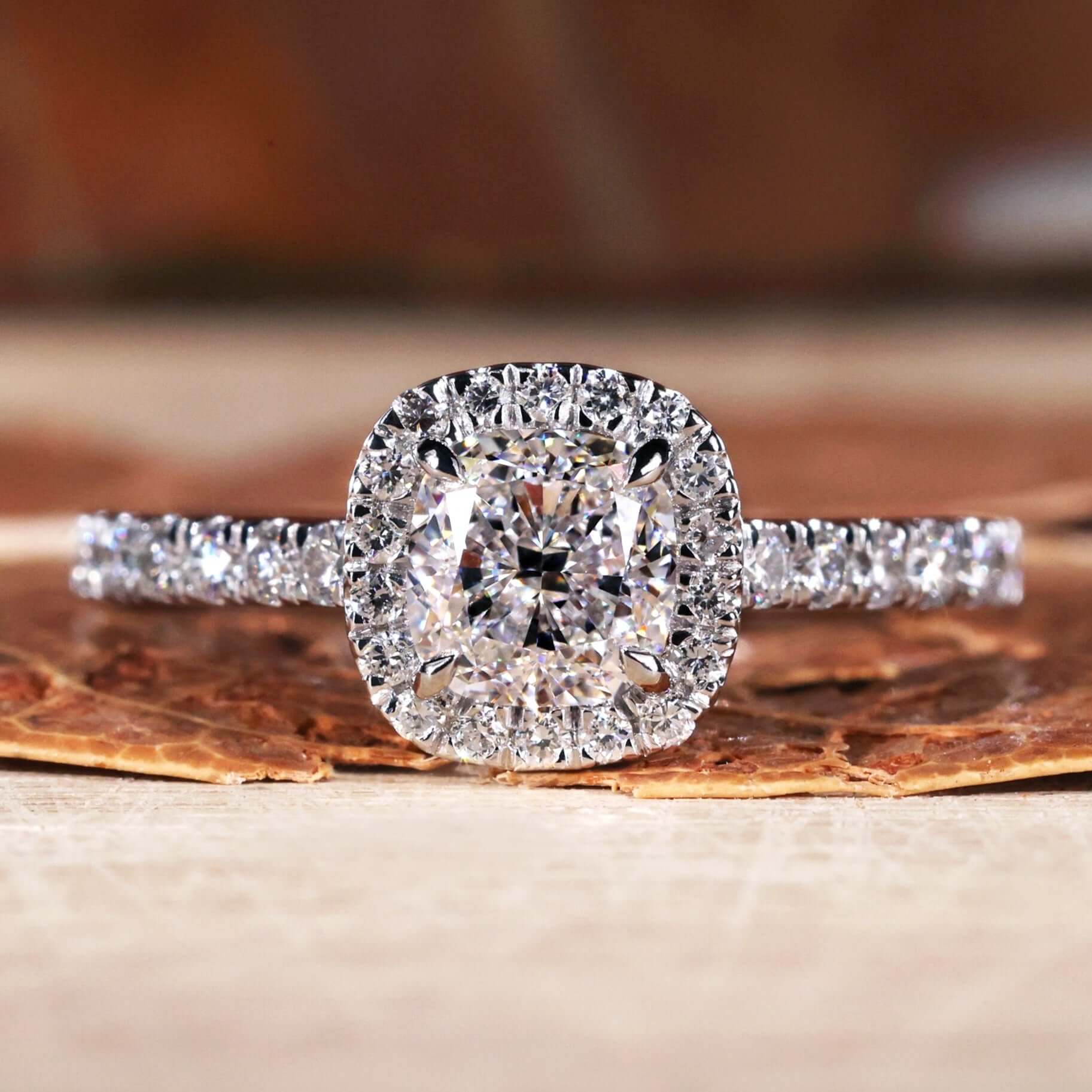 Cushion cut engagement ring with a halo setting for elegance