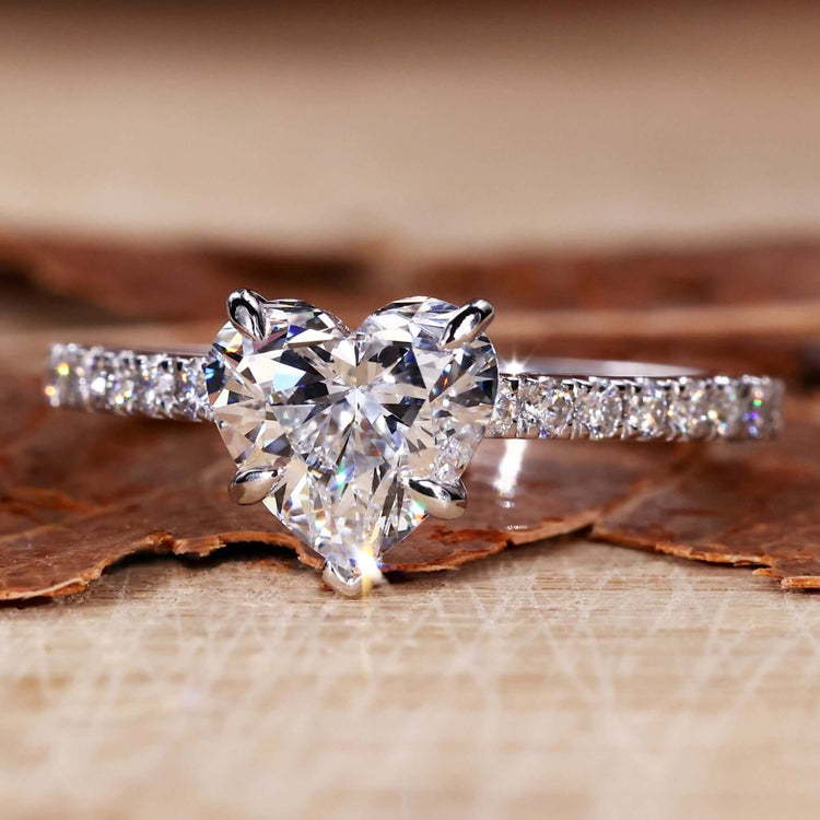 Heart diamond shape ring with 4 prong claw setting in a unique engagement ring design for modern brides.