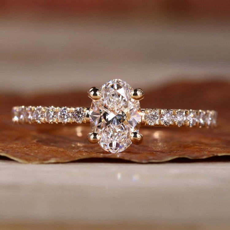 Oval diamond engagement ring with a stunning 4 prong diamond setting for timeless elegance.