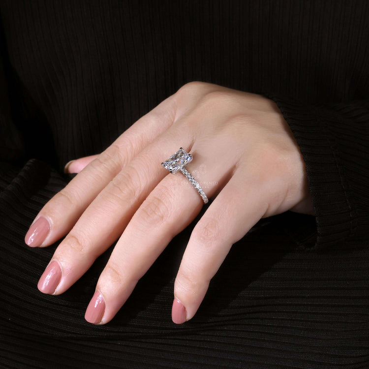 Handmade jewelry featuring a radiant cut ring and pave set diamonds for sophisticated elegance.