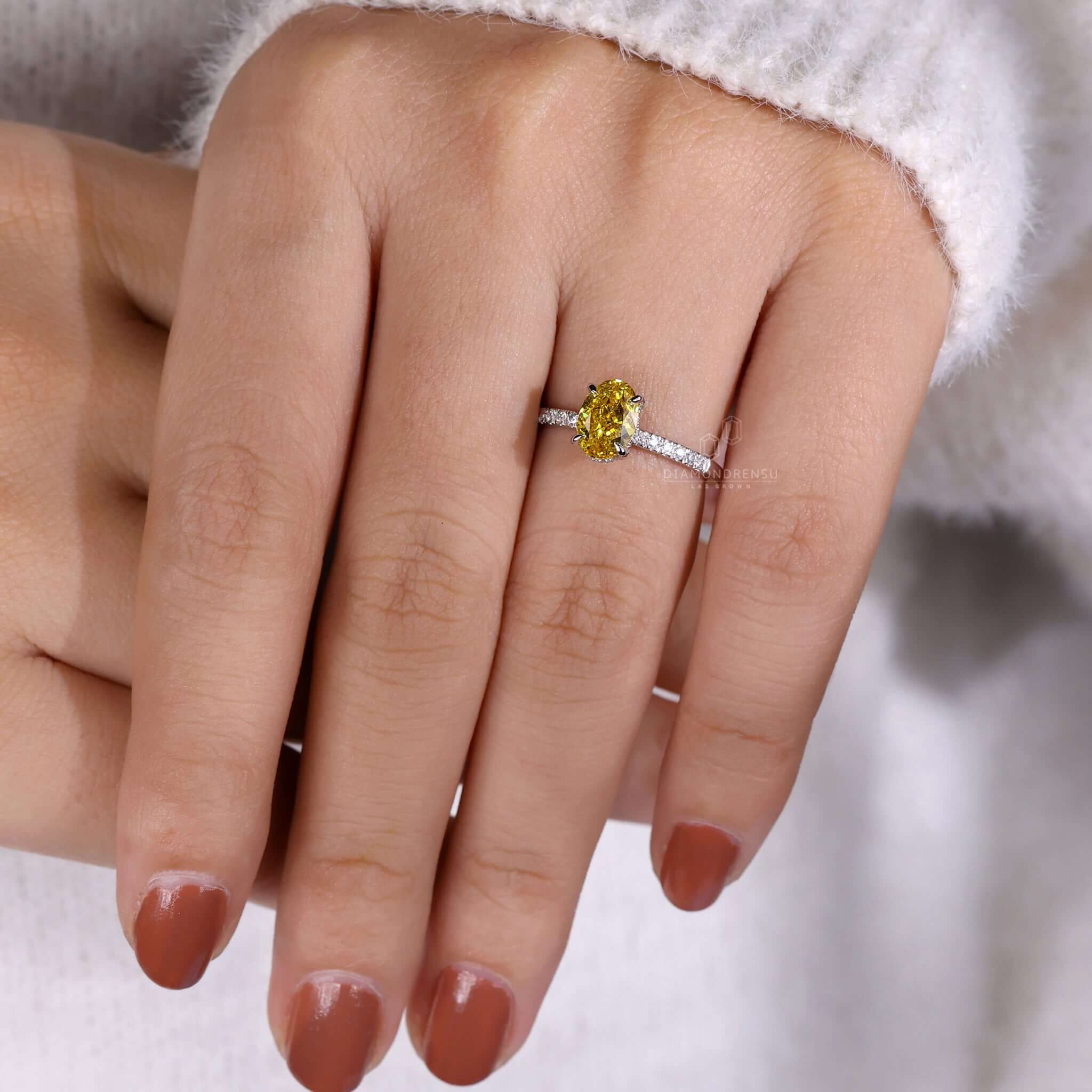 Engagement ring hidden halo featuring pave diamonds and a Lab Grown Diamond for sustainable luxury.