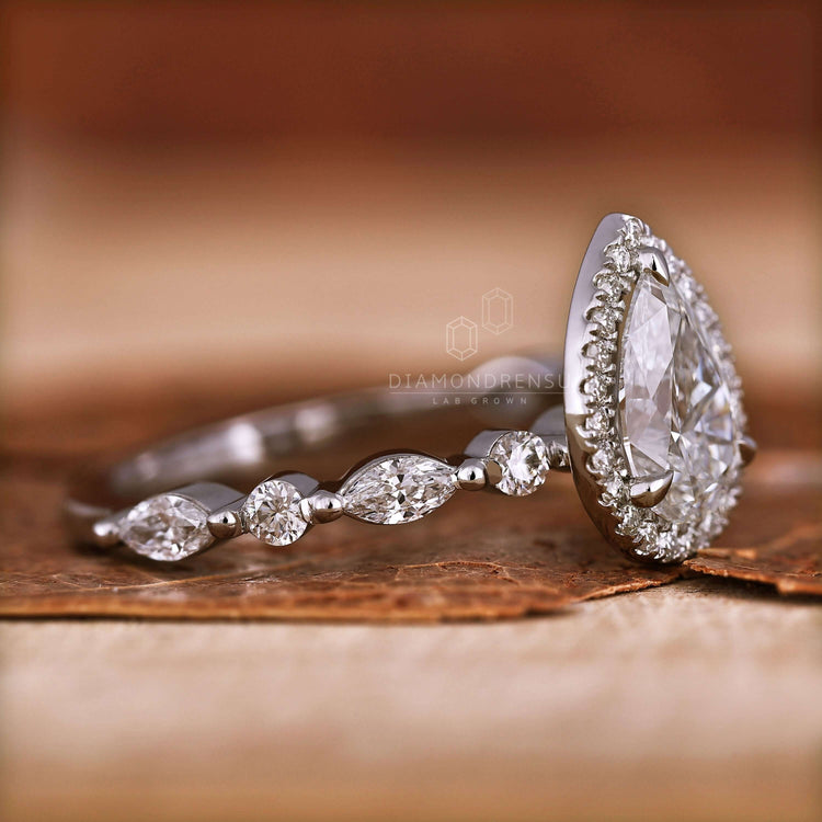 Pear shaped ring diamond with a pear halo engagement ring design, ideal as an engagement ring for women.