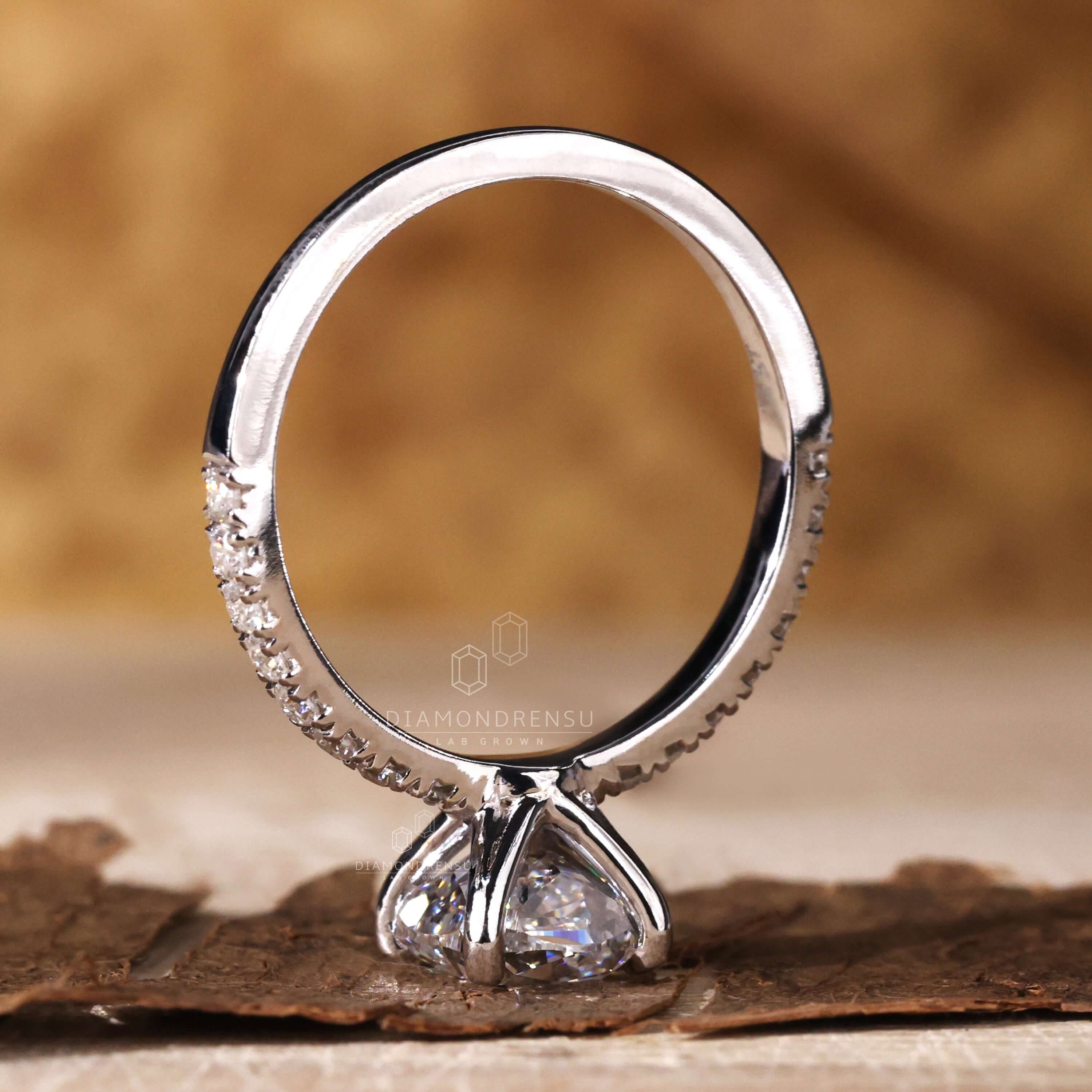 Cushion ring cut with pave set diamonds, ideal for anyone seeking a UK engagement ring with modern elegance.