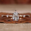 Pear shaped diamond ring with a pave ring design, perfect for elegant engagement moments and timeless beauty.