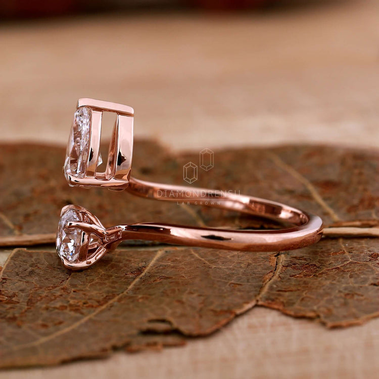 Moi et toi ring featuring a bypass ring setting and lab grown diamond for sustainable beauty.