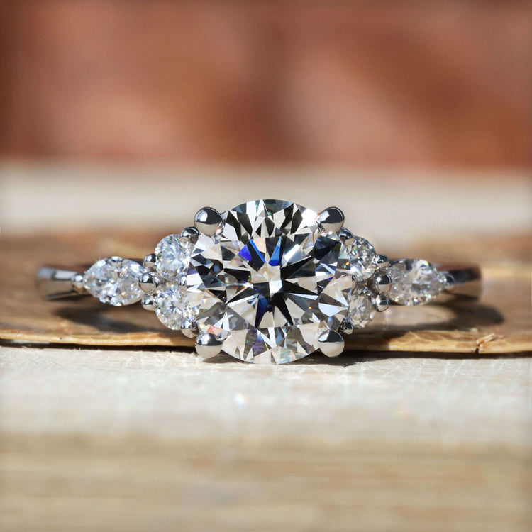 Simple proposal ring featuring a round cut diamond with a tapered shank engagement ring for timeless elegance.