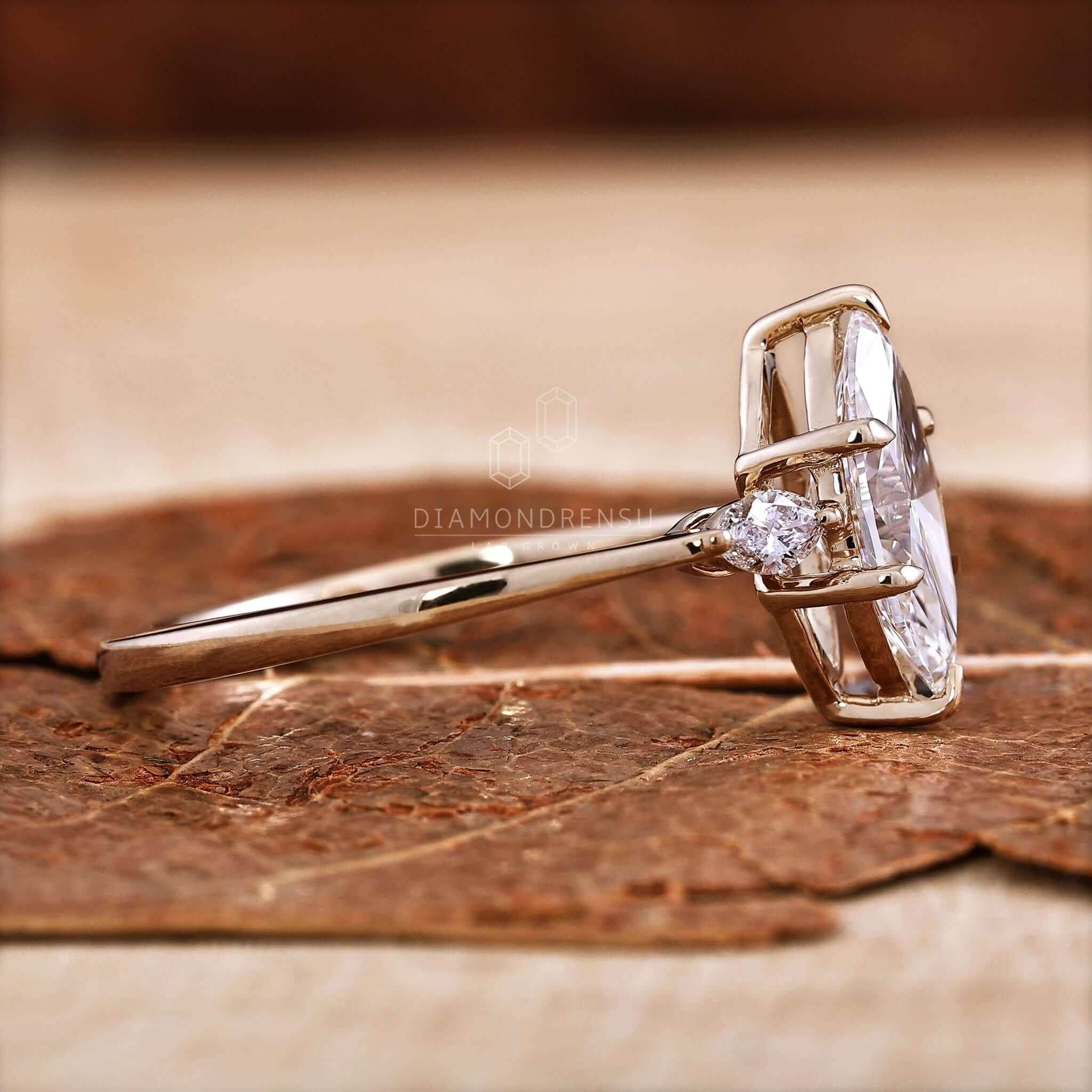 Three stone ring crafted with brilliant diamonds and timeless charm.