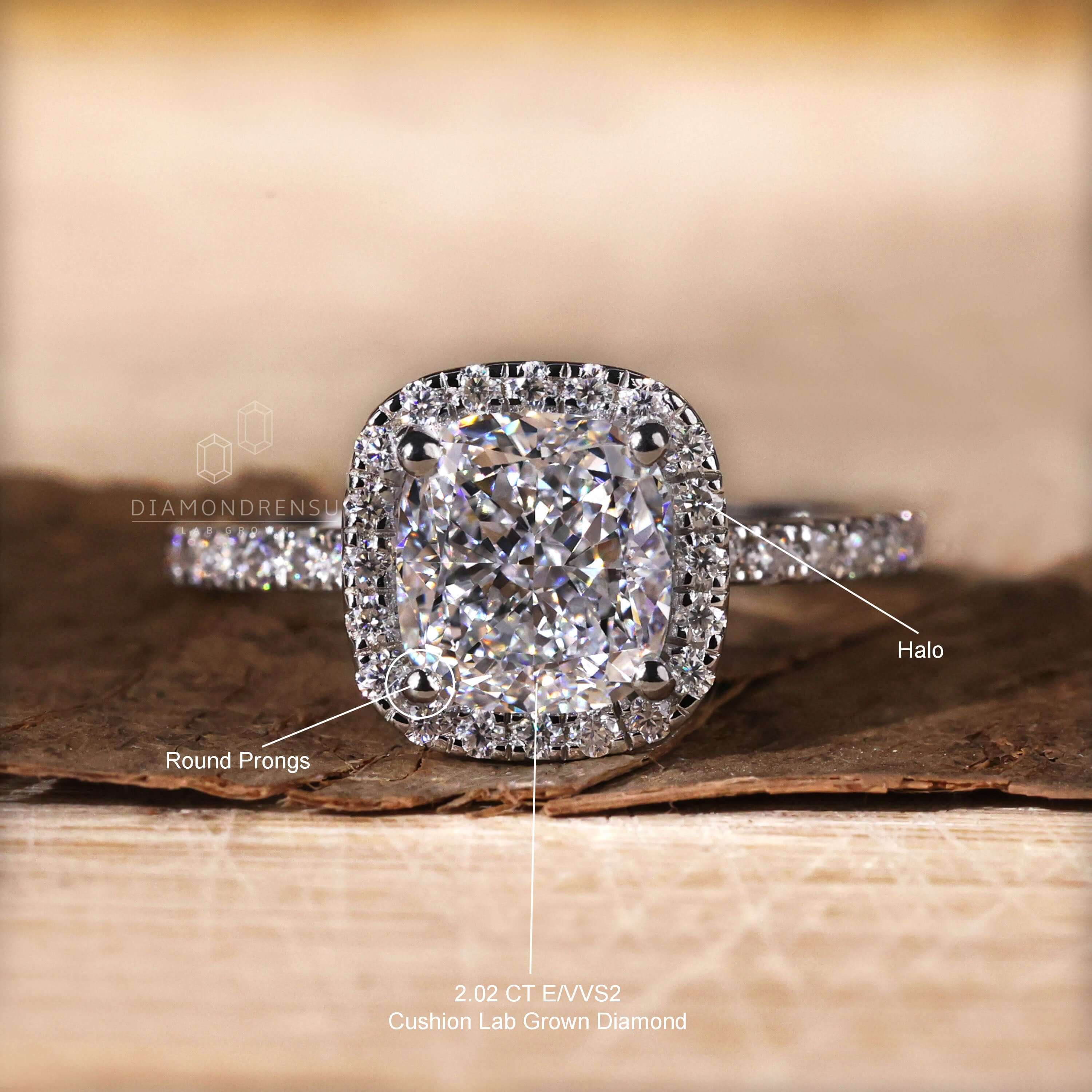 Halo ring paired with a cushion cut diamond and pave set band for enhanced brilliance.
