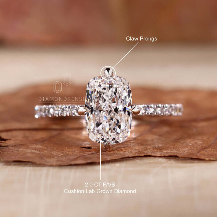 Gold pave set ring with a lab-grown elongated cushion diamond centrepiece.