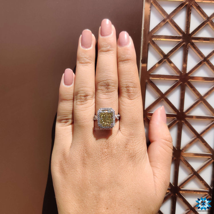 Hidden halo engagement ring with radiant cut center.