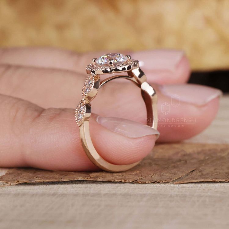 Halo diamond engagement ring with a round cut centrepiece.