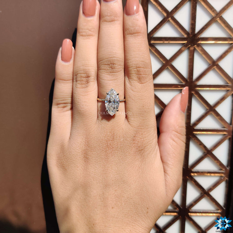 Twisted shank engagement ring with marquise cut center.