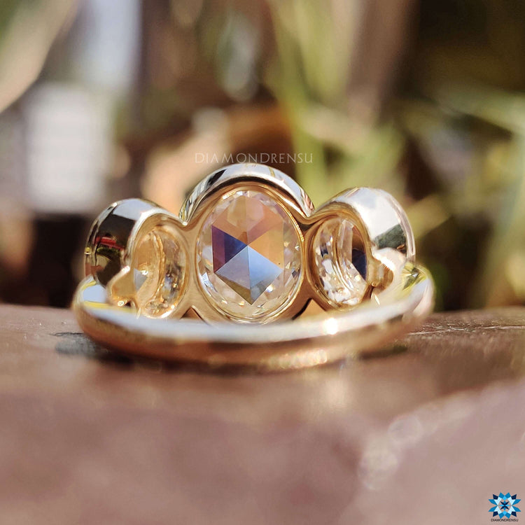 Rose cut moissanite ring with three stones.
