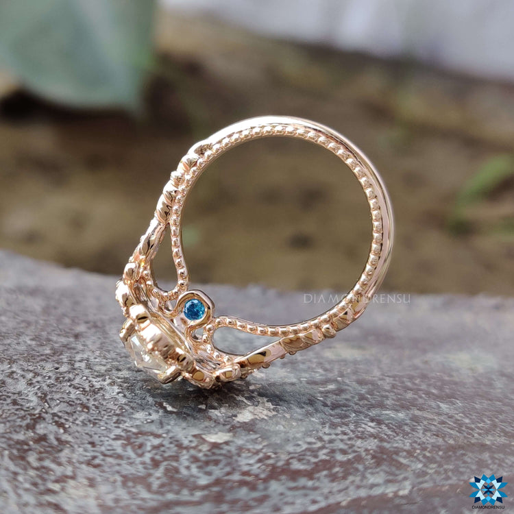 Side stone moissanite ring with round cut stones.