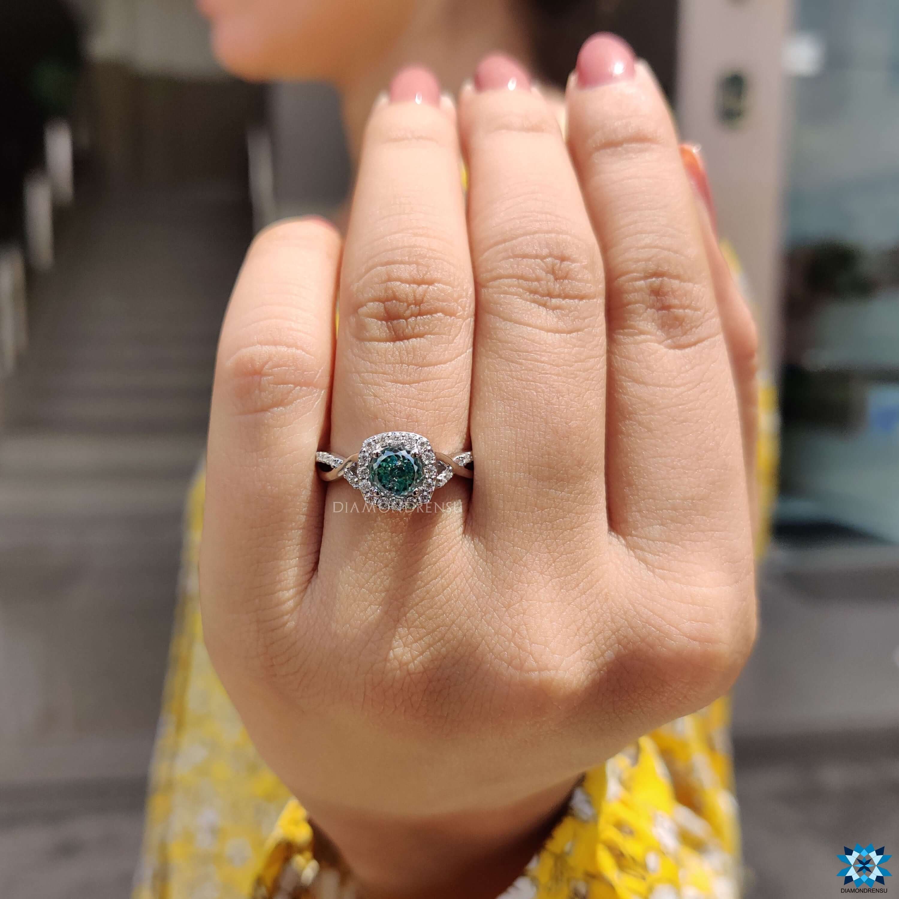 Cyan blue Portuguese cut moissanite ring.