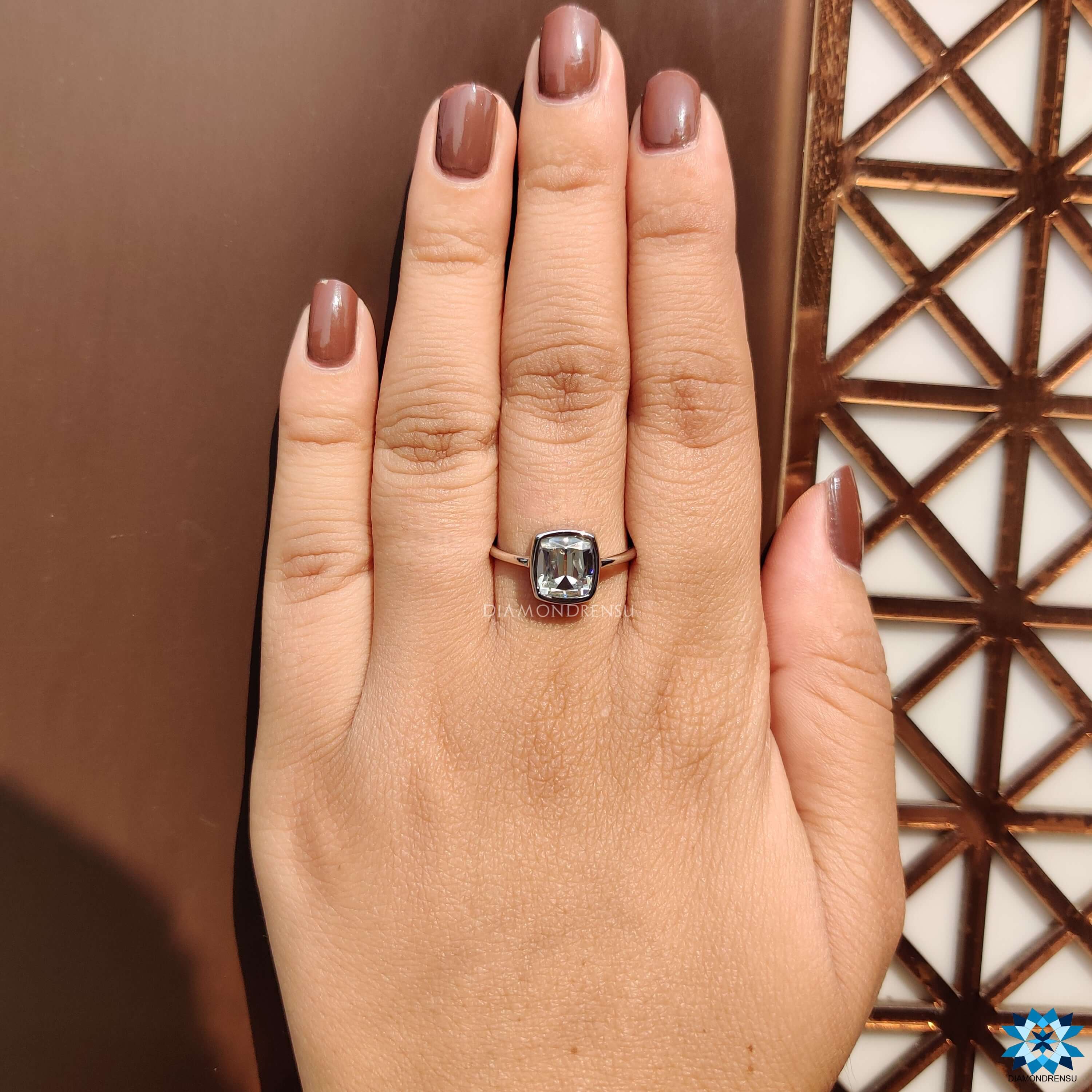 Diamondrensu UK cushion cut moissanite solitaire ring.