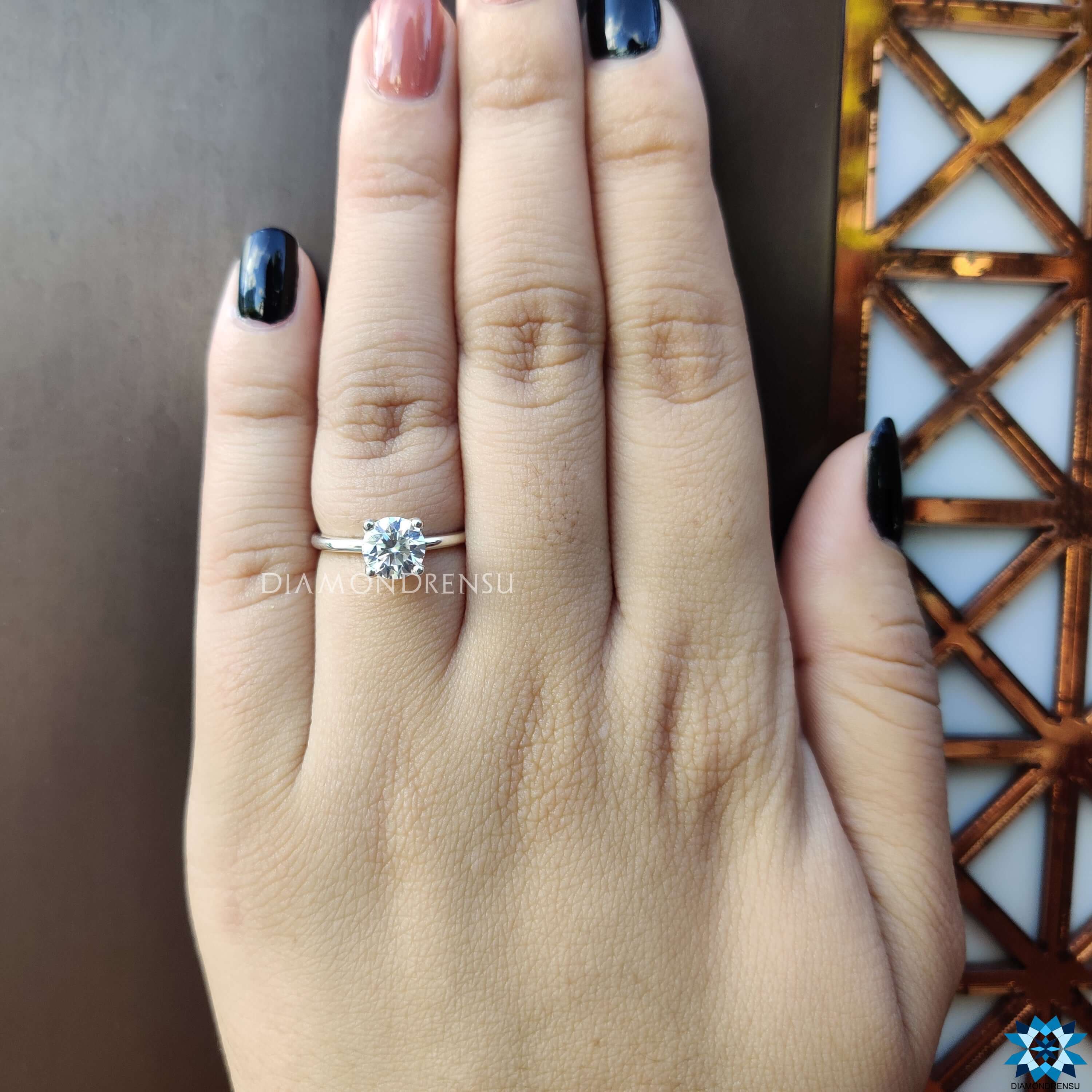 White gold engagement ring with moissanite solitaire.