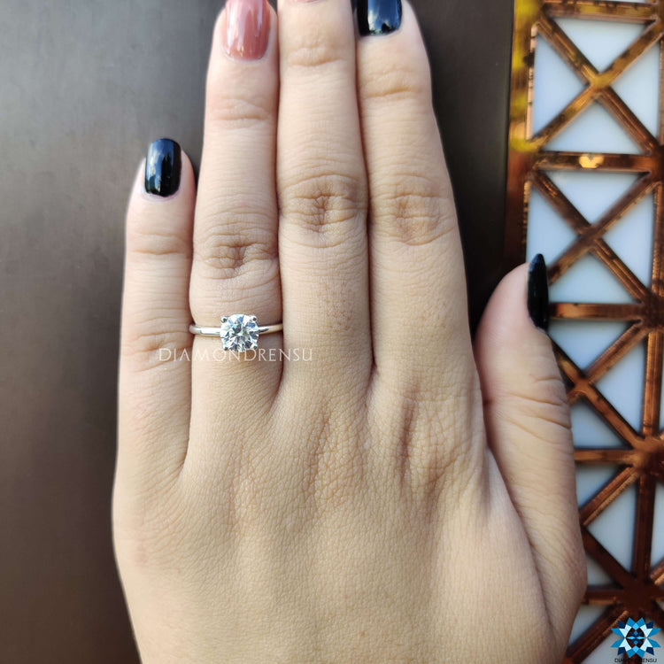 White gold engagement ring with moissanite solitaire.