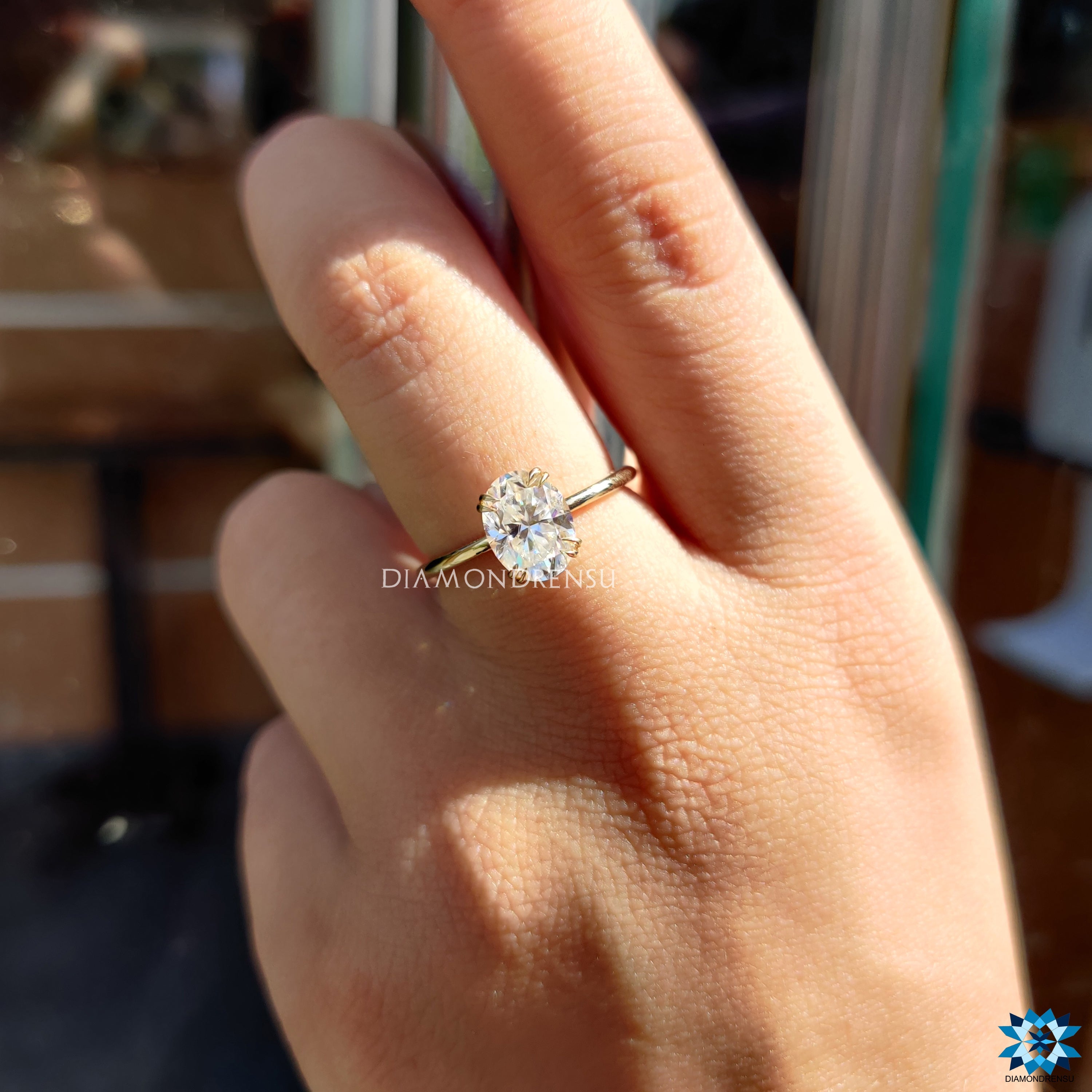 Handmade moissanite ring with oval cut and prong design.