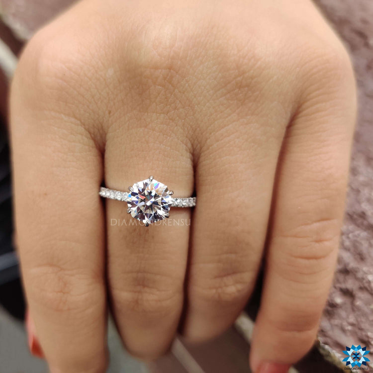 White gold engagement ring with octagon moissanite center.