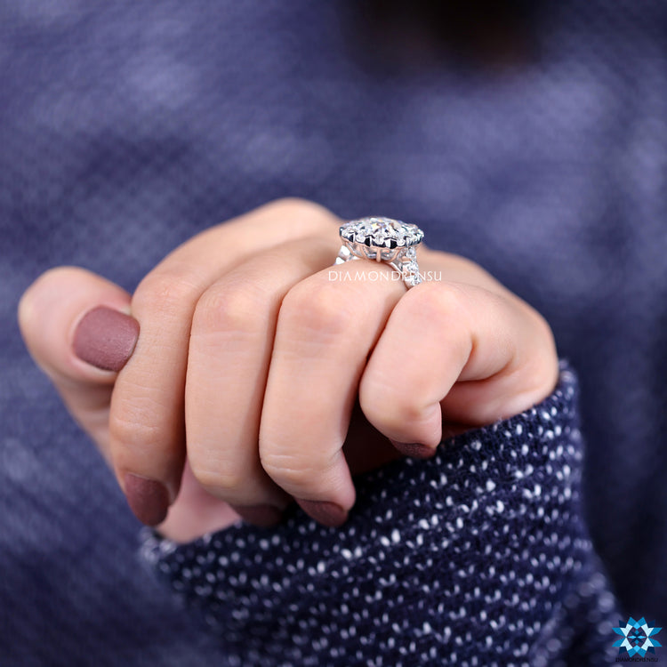 Claw prong setting ring with old mine cut and halo design.