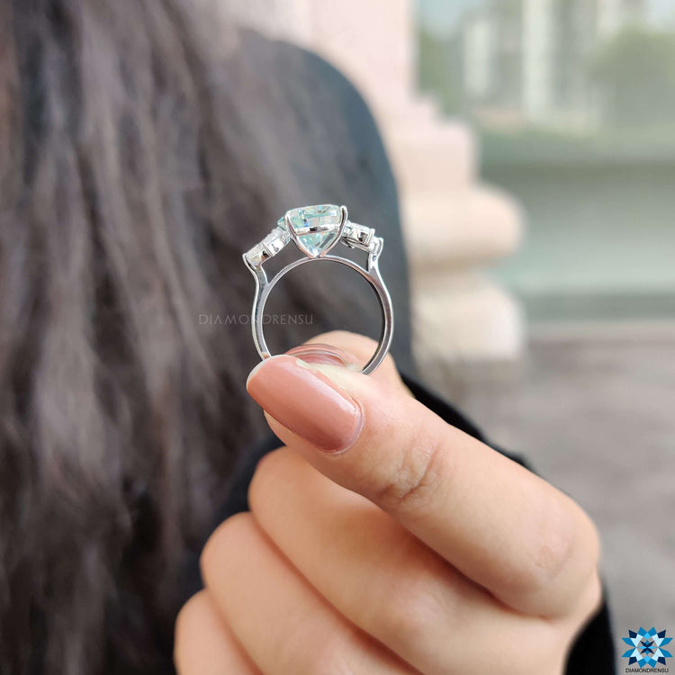 Handmade pear moissanite ring in white gold.