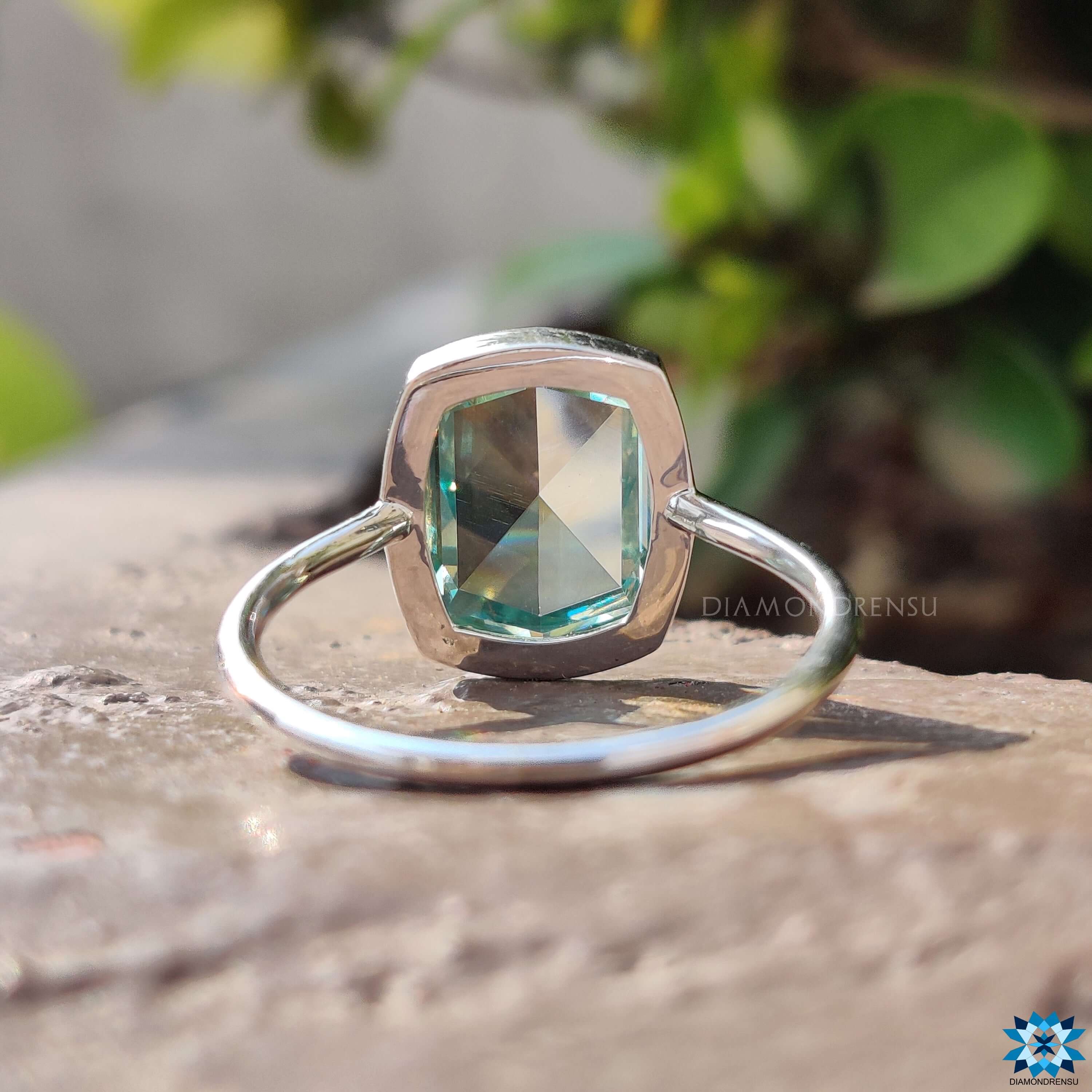 Custom white gold ring with cushion rose cut cyan blue moissanite.