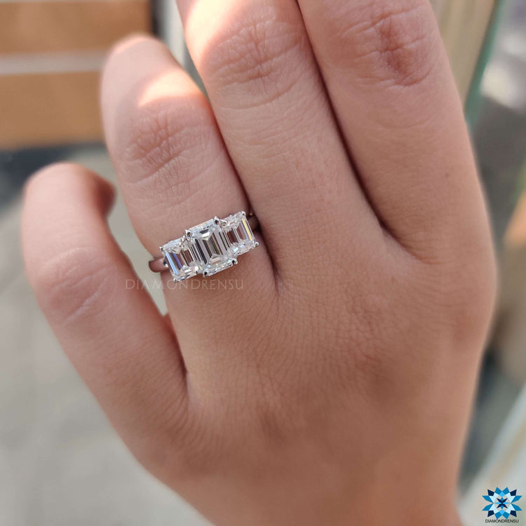 Elegant moissanite ring in three stone design.